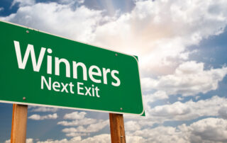 Winners Next Exit sign